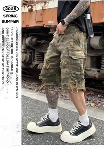 Detailed view of men's distressed camo cargo shorts with vintage washed texture