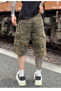 American vintage washed camouflage cargo shorts with heavy distressed ripped details for men