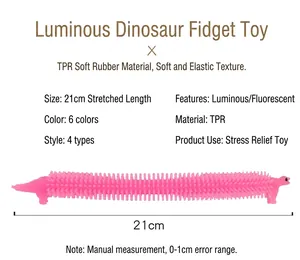 Detailed view of a 21cm pink glow-in-the-dark dinosaur sensory stretch toy for stress relief