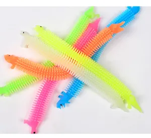 Colorful dinosaur and alpaca stretchable fidget toys with sensory textured surface spikes.