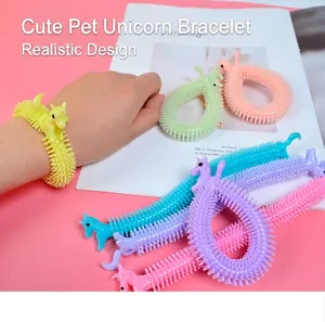 Detailed macro view of colorful cartoon unicorn stretchy bracelets for stress relief