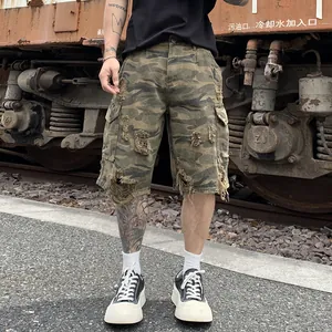 Vintage style men's camo cargo shorts with distressed ripped details and a relaxed fit.