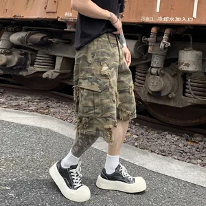 Distressed camouflage cargo shorts for men with vintage heavy wash and ripped details