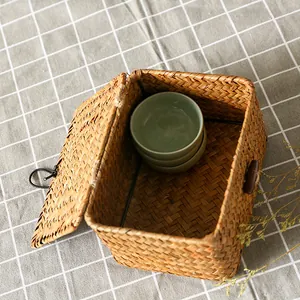 Handmade bulrush woven storage box with lid for rustic desktop organization and decor