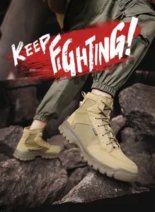 Close-up of men's khaki high-top outdoor boots worn while climbing on rocky terrain