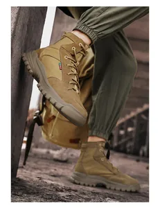 Close-up of khaki high-top work boots with rugged anti-slip soles for outdoor use