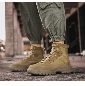 Side detail view of men's khaki high-top outdoor work boots with rugged lug soles.