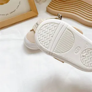 Close-up of anti-slip rubber outsole on baby walking shoes with size 13.0 marking