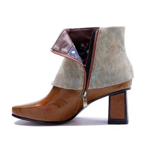Close-up detail view of vintage leather ankle boot with side zipper and chunky heel