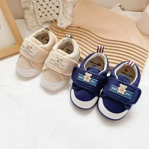 Soft sole cartoon baby walking shoes with anti-slip velcro straps in beige and navy