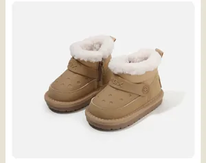 Detailed view of khaki children's snow boots featuring soft plush lining and side zipper closure.