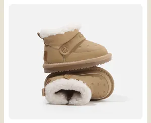 Close-up view of children's khaki snow boots featuring soft white fleece lining and star logo.