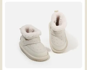 Detail view of cream children's winter snow boots with soft plush lining
