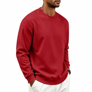 Detail view of a men's heavy red crewneck sweatshirt with ribbed cuffs and hem.