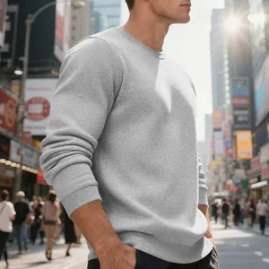Side view detail of a heavy grey fleece crew neck sweatshirt in an urban street setting