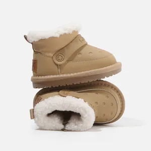 Beige children's winter snow boots featuring warm plush lining and a decorative star strap