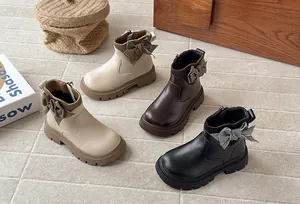 Stylish girls leather Martin boots with houndstooth bow in beige brown and black colors