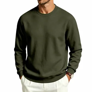 Detail of men's olive green crewneck sweatshirt with ribbed cuffs and heavy fabric