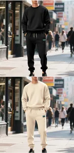 Men's heavy crewneck sweatshirt and joggers tracksuit set in black and cream lifestyle.