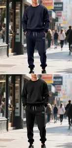 Detail view of black and navy men's heavy fleece sweatshirt and joggers set in a city setting.