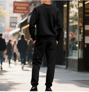 Back view of men's heavy black fleece sweatshirt and sweatpants set in urban setting
