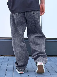 Back view detail of oversized grey acid wash denim jeans for men with loose fit style