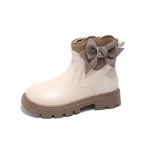 Beige girls' leather Martin boots with a brown houndstooth bow and knitted collar