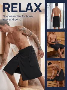 Detail view of men's wearable black bath towel wrap with pocket and velcro in sauna setting.