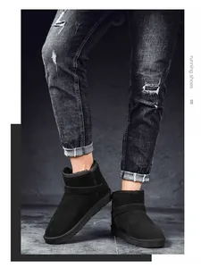 Detailed shot of black suede snow boots featuring warm fleece lining and durable rubber sole
