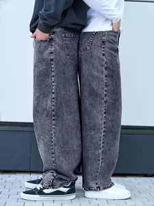 Detailed view of oversized grey washed loose straight denim jeans for men