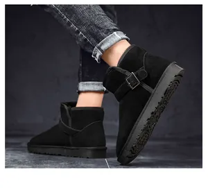 Detailed view of black suede snow boots featuring a stylish side buckle and thick non-slip sole