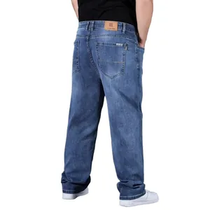 Detailed back view of men's loose straight-leg oversized blue washed denim jeans