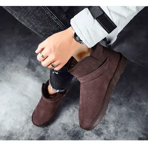 High-quality brown suede snow boots with thick fur lining and anti-slip rubber sole.