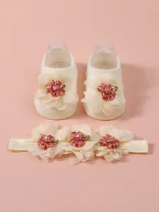 Elegante conjunto de calcetines de malla y diadema floral para recién nacidos en rosa