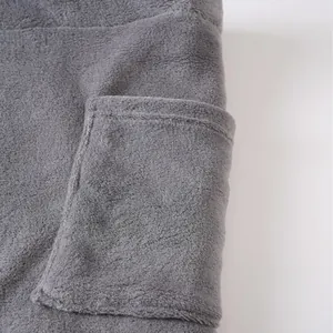 Grey plush men's wearable bath towel bathrobe with a functional side pocket design.