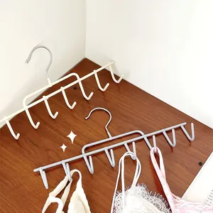 Versatile multi-hook storage hanger for belts, scarves, and camisoles in closet organization.
