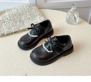Elegant black girl's leather shoes with bow and lace detail on soft sole princess flats