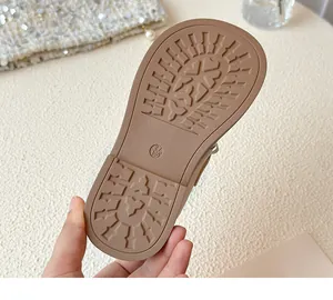 Close-up detail of the anti-slip soft rubber sole on girls' princess leather shoes