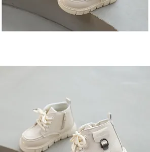 Close-up of children's cream Martin boots with side zipper and decorative buckle