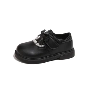 Elegant girls black leather princess dress shoes with charming bow and delicate lace detail