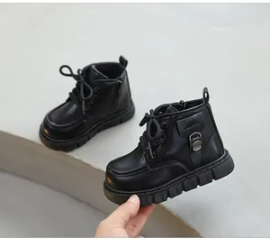 Close-up of black leather Martin boots for toddlers featuring a side zipper detail