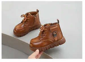 Classic vintage brown children's Martin boots with side buckle and zipper details for winter