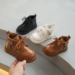 Variety of children's stylish British Martin boots in brown, black, and cream colors