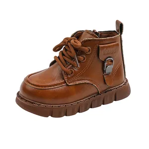 Close-up of brown vintage British style Martin boots for kids with side buckle detail