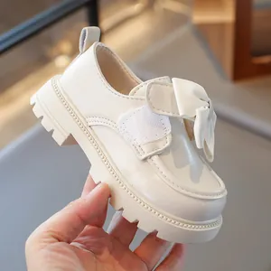 Cream-colored girls' princess loafers with decorative bow and chunky non-slip sole