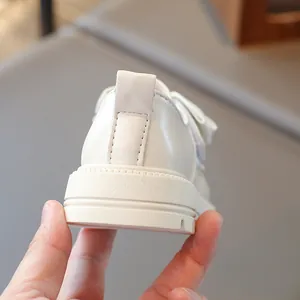 Detailed close-up showing the sturdy heel and soft sole of white girls' princess leather shoes