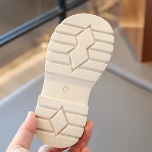 Close-up view of the anti-slip soft sole of children's loafers with size 26 marking.