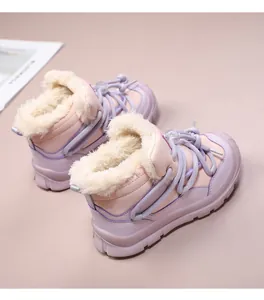 Macro detail of cozy purple children's snow boots with thick white faux fur lining