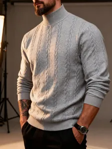 Detail view of men's grey high neck cable knit sweater with intricate jacquard texture