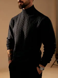 Detail of black cable-knit turtleneck sweater showing the rich jacquard texture